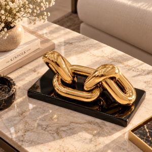 Golden Link Sculpture on Marble Table